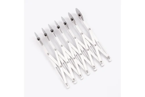 Close-up of plain stainless steel cutting wheels on expandable dough divider
